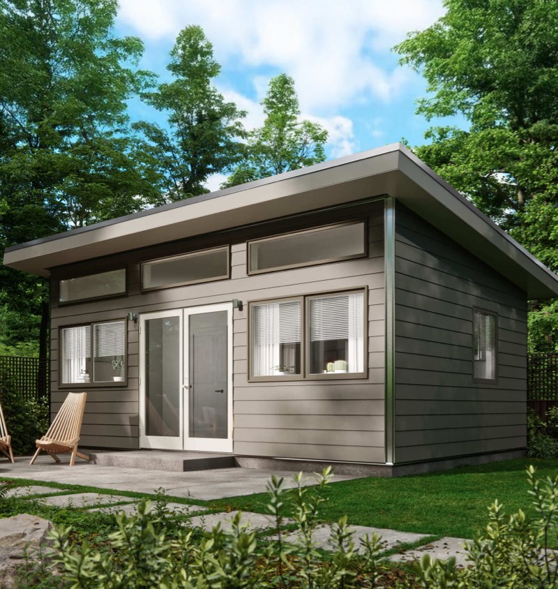 Studio Shed summit series unit with iron gray siding and white doors